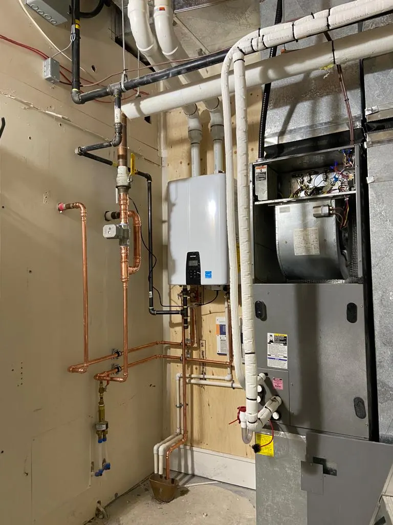 Estate mechanical room: Tankless heater and main supply