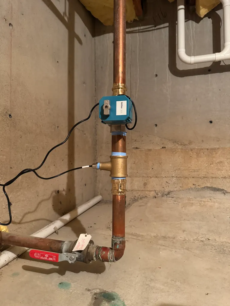 Valve and flow sensor on the main: Basement, copper supply